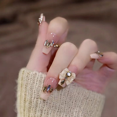 Lot de 24 faux ongles roses style Y2K à coller avec de gros strass scintillants et des pointes françaises noires pour femmes